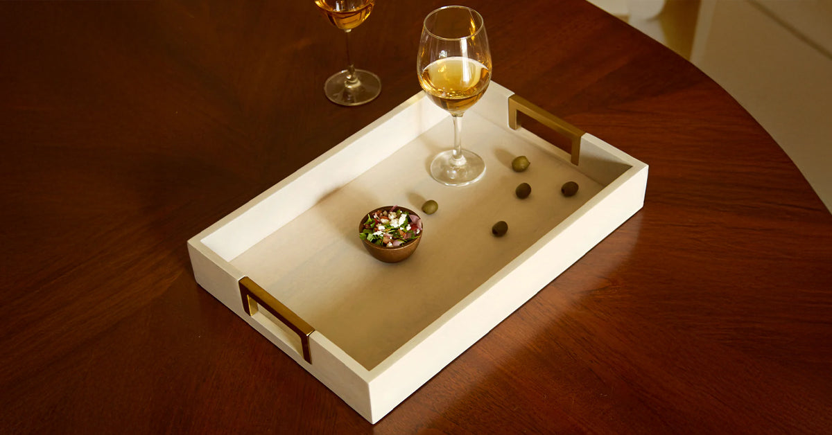 What makes serving trays a design essential?